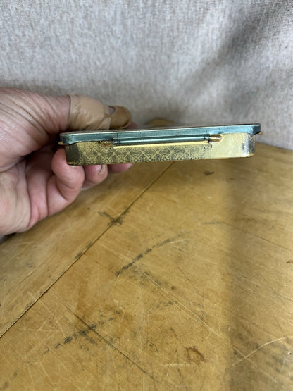 Sporting Empty Cigarette Tin